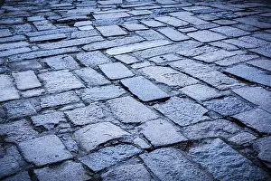 Deserted Roadway Scene Prints: Cobblestone pavement background