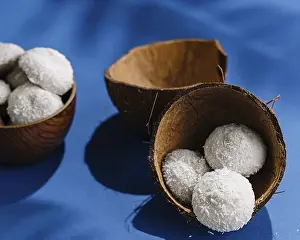 Tropical Fruit Photography Prints: Coconuts with candies on blue table