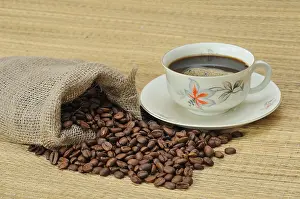 Freshly Ground Coffee Prints: Coffee beans next to a coffee cup