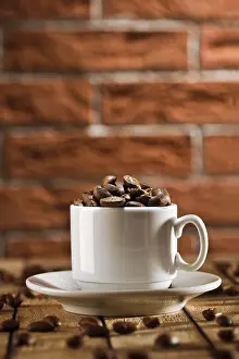 Brown Roasted Coffee Beans Prints: Coffee beans in the cup