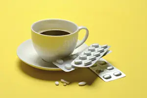 Coffee And Medication Prints: Coffee in a cup and medication