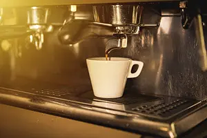 Coffee Machine Detail Prints: Coffee machine putting a decaf in a white cup