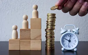 Business Concept Image Prints: Coins Stack with wooden doll model