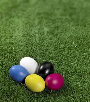 Colourful Easter Tradition Prints: Some colored Easter eggs in green artificial grass background