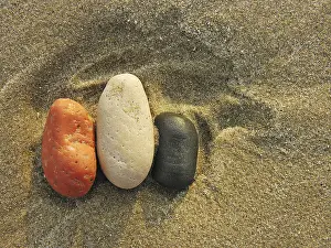 Colored Pebbles Prints: Colored pebbles in the sand