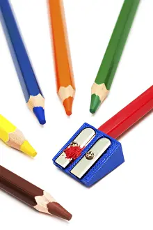 Colored Pencils Prints: Colored pencils and sharpener on a white background