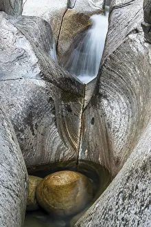 Blurred Motion In Nature Prints: Colored rock structures and water