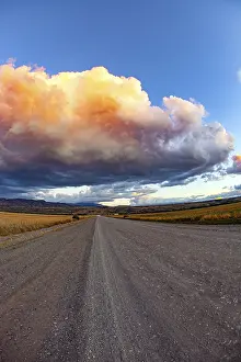 South American Weather Forecast Prints: Colossal thundercloud is pierced by lightning strikes and illuminated by the sunset