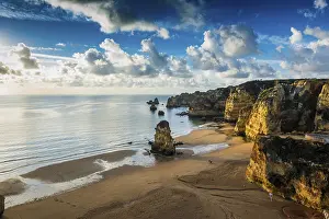 Cloudy Morning Sky Prints: Coloured cliffs and sunrise at the beach