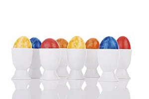 Studio Shot Of Easter Eggs Prints: Colourful easter eggs in eggcups