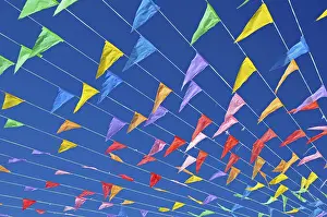 Costa Blanca Spain Prints: Colourful flags against a blue sky