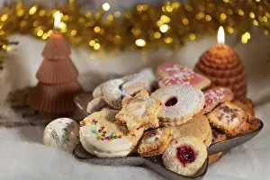 Uninhabited Bakery Scene Prints: Colourful selection of biscuits with two burning candles