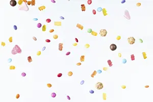 Colourful Dessert Photography Prints: Colourful sweets fall against a white background