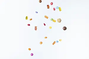 Colourful Sweets Prints: Colourful sweets fall against a white background