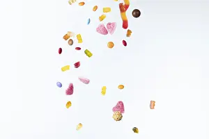 Colourful Sweets Prints: Colourful sweets fall against a white background