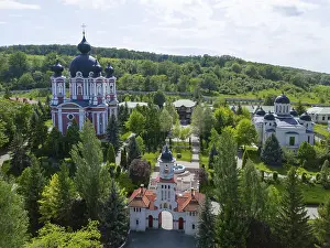 Prints of Combination of several religious buildings and lush vegetation in hilly surroundings, aerial view, Cathedral of the Nativity of Mary on the left, Curchi monastery, Orhei district Moldova Prints: Aerial View Print of Moldovan Religious Landscapes