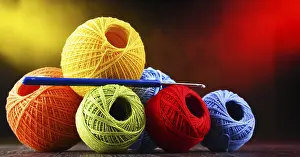 Handicraft Supplies Prints: Composition with assortment of different colored yarns and hook for crocheting