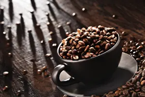 Caffeine Nutrition Facts Prints: Composition with cup of coffee and beans