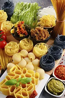 Kitchen Table Setup Prints: Composition with different sorts of pasta on kitchen table