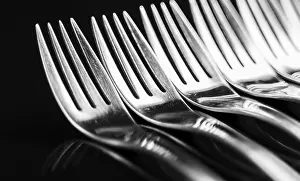 Minimalist Art Prints: Composition of Forks on Black Background Print