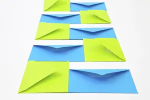 Communication Symbols Prints: Composition with green and blue envelopes on the white table