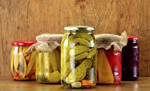 Deserted Table Setting Food Prints: Composition with jars of pickled vegetables