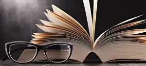 Educational Institution Art Print Prints: Composition with open book and glasses on the table