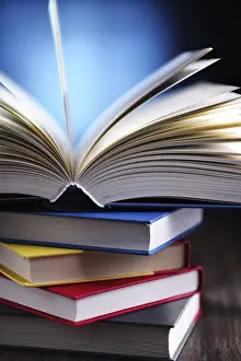 Educational Institution Art Print Prints: A composition with an open book lying on a stack of other books