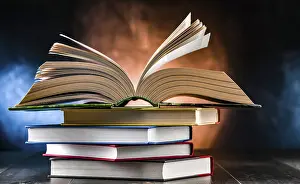 Educational Institution Art Print Prints: A composition with an open book lying on a stack of other books