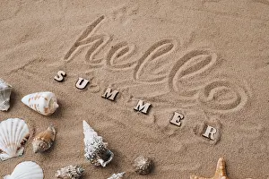 Text Free Space For Holidays Prints: Composition with text HELLO SUMMER seashells