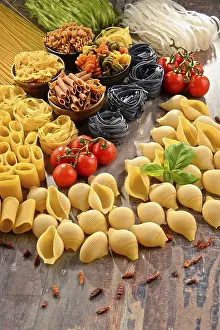Kitchen Table Setup Prints: Composition with variety of pasta on kitchen table