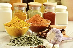 Kitchen Table Setup Prints: Composition with variety of spices on kitchen table