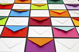 Colourful Desk Supplies Prints: Composition with white and colored envelopes on the table