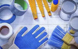 Construction Industry Equipment Prints: Composition of working paint tools on blueprint construction concept