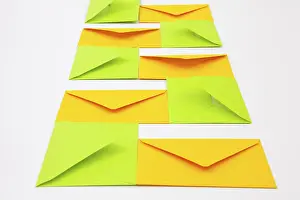 Communication Symbols Prints: Composition with yellow and green envelopes on the white table