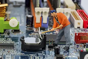 Computer Motherboard Prints: Computer board and worker, symbol photo for computer