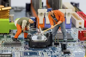 Computer Motherboard Prints: Computer board and worker, symbol photo for computer