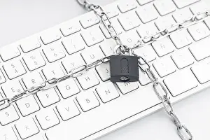 Computer Hacking Protection Prints: Computer Security concept. Chain and padlock on keyboard