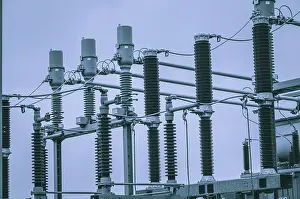 Electricity Supply System Prints: Concept of electricity and power generation using the example of insulators and devices in a substation