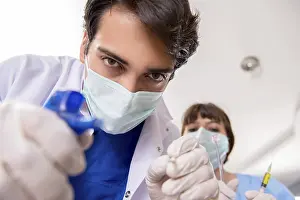 Healthcare Profession Prints: Concept of treating teeth at dentists