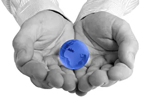 Deserted World Map Prints: Conceptual image of a globe in hand