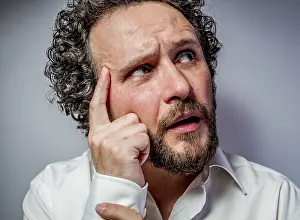 Man Looking At Camera Prints: Concern for the future, man with intense expression