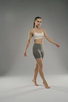 Athletic Wear Prints: A confident model strides gracefully across a smooth surface