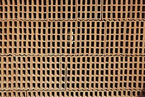 Empty Construction Yard Prints: Construction bricks stacked red clay brick