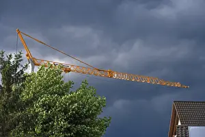 Gloomy Weather Forecast Prints: Construction crane in a thunderstorm
