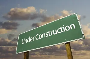 Cloudy Sky Background Prints: Under construction green road sign over dramatic clouds and sky
