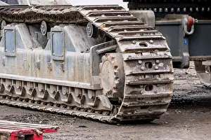 Deserted Construction Site Prints: Construction machine with caterpillar tracks