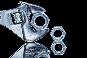 Close Up Construction Equipment Prints: Construction nuts adjustable spanners on black background