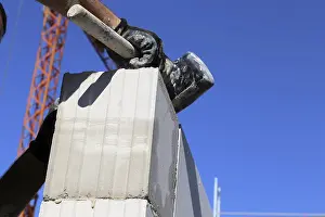 Manual Laborer At Work Prints: Construction worker (bricklayer) on the building site