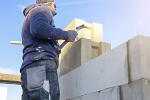 Bricklayer Detail Prints: Construction worker (bricklayer) on the building site